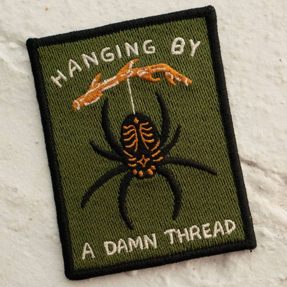 Écusson - Hanging by a Thread